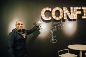Hosein signs our "Confidence" wall